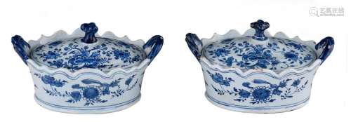 A pair of Dutch Delft blue and white butter tubs, floral dec...