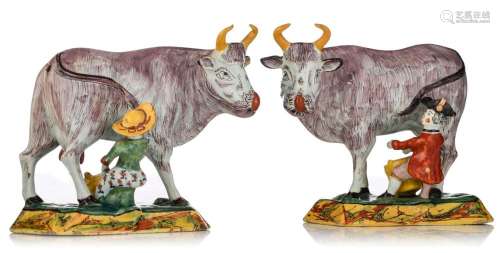 A large pair of Delft polychrome models of cows with milkers...