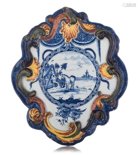 A fine Dutch Delft plaque depicting a pastoral scene with ro...