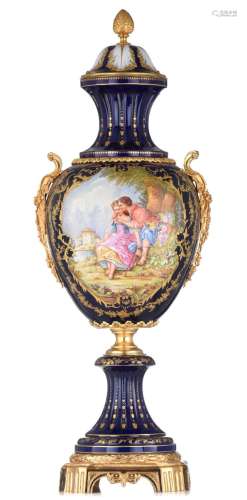 An imposing Sèvres type vase and cover, decorated with a cen...