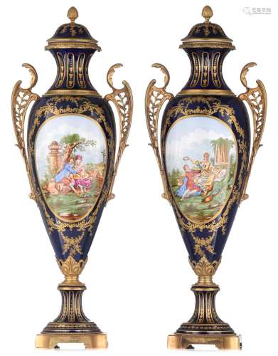An imposing pair of Sèvres type vases and covers, decorated ...