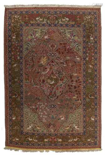A Persian Ispahan rug, decorated with phoenix, various birds...