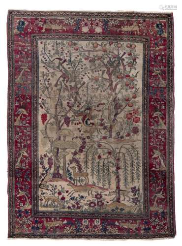 An antique Persian Ispahan rug, depicting the tree of life w...