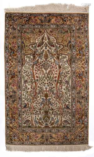 An Istanbul silk on silk rug, decorated with the tree of lif...