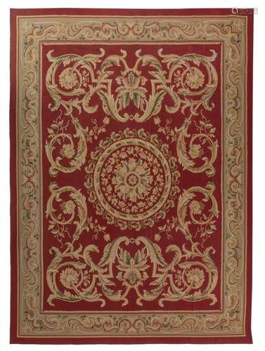 An Aubusson type carpet, floral decorated with a central med...