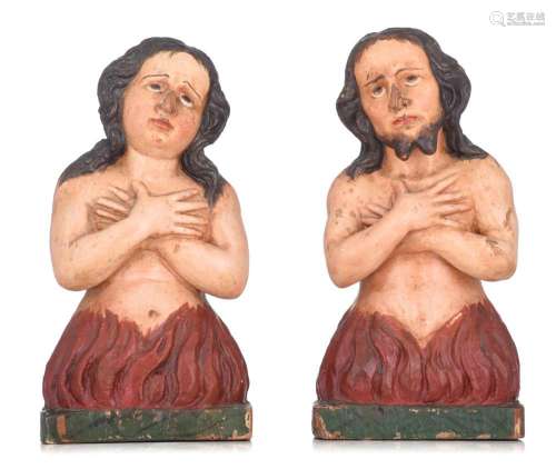 A pair of polychrome painted oak figures burning in the flam...