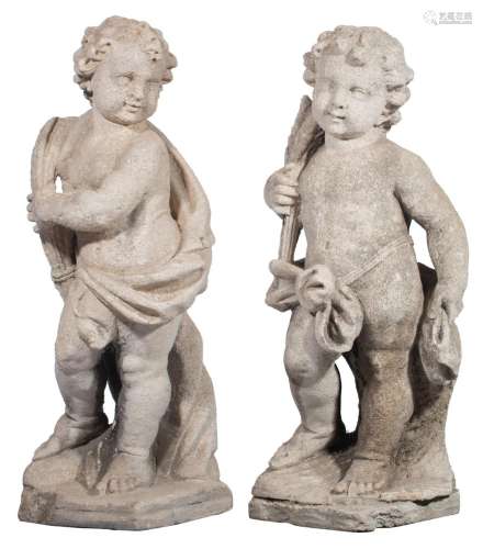 A pair of limestone figural garden sculptures depicting spri...