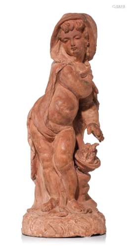 A terracotta figure of a putto warming himself, representing...