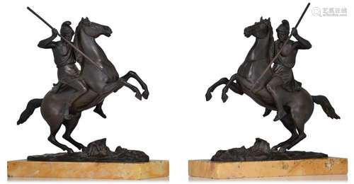 A fine pair of patinated bronze Phrygian warriors on prancin...