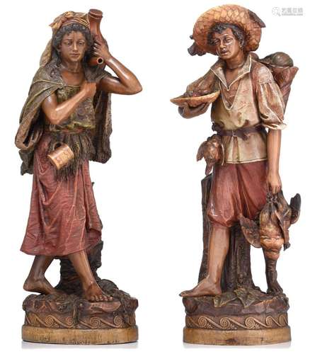 A pair of polychrome painted terracotta gypsy figures, in th...