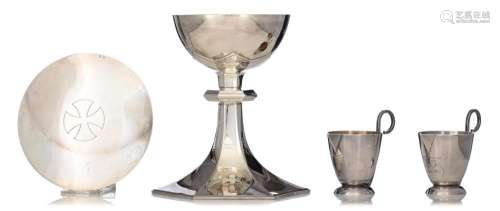 Two Art Deco style silver and gilt silver chalices and paten...