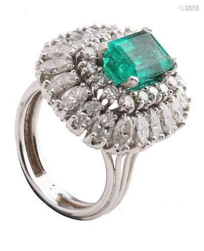 An emerald and diamond ring