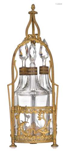 A fine Art Nouveau gilt brass cruet set with three cut glass...