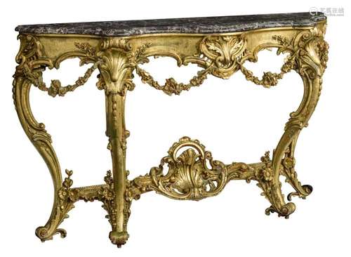 A Rococo style gilt and carved wooden console table, with a ...