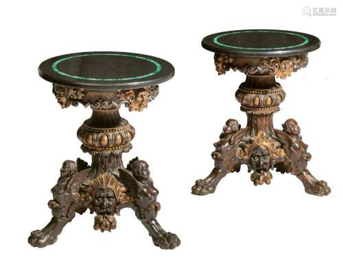 A pair of Renaissance Revival side tables, richly carved wal...