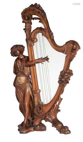 A carved pine beauty playing the harp, with an inlaid bisaut...
