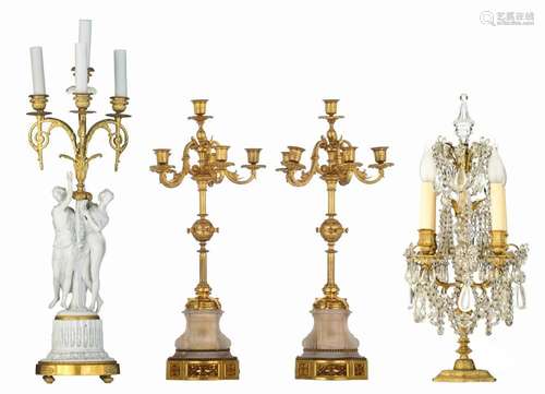 A collection of various candelabras and a girandole, H 61,5 ...