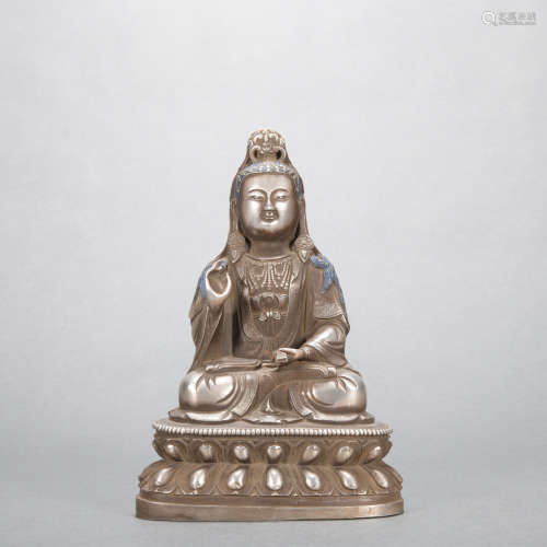 A silver statue of bodhisattva
