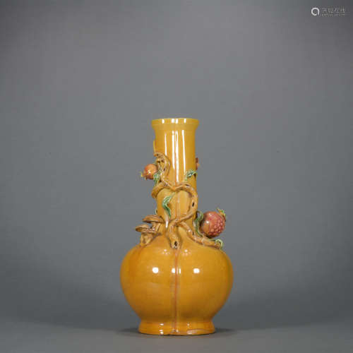 A yellow glazed vase