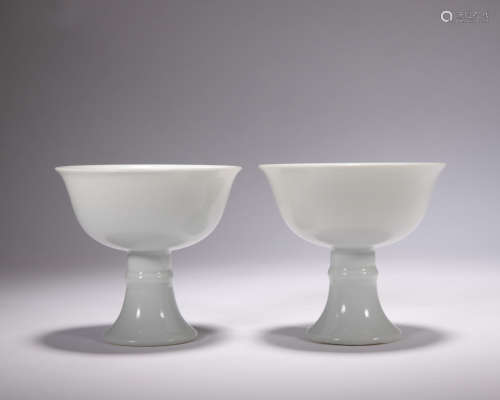 A pair of white glazed cup