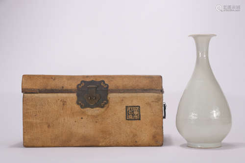 A white glazed pear-shaped vase