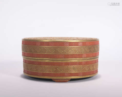 An allite red glazed box and cover painting in gold