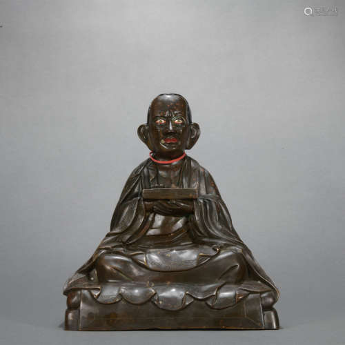 A bronze statue of Master Buddha