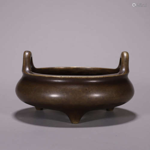 A double-eared three-legged copper censer