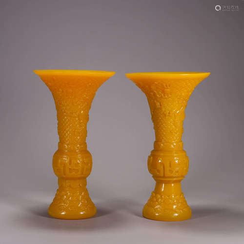 A pair of cloud and dragon yellow glass beaker vases