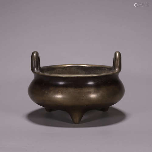 A double-eared three-legged copper censer