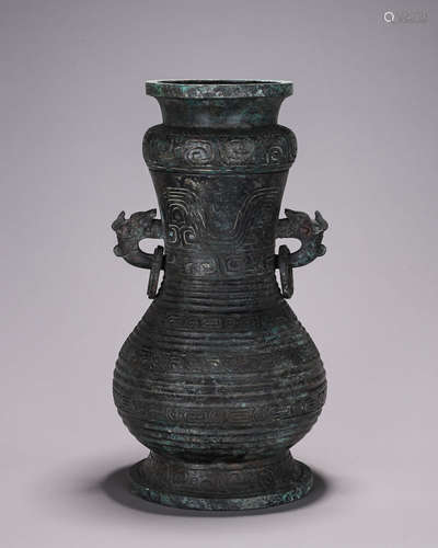 A bronze dragon head vase