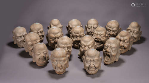 A set of eighteen porcelain arhat buddha heads