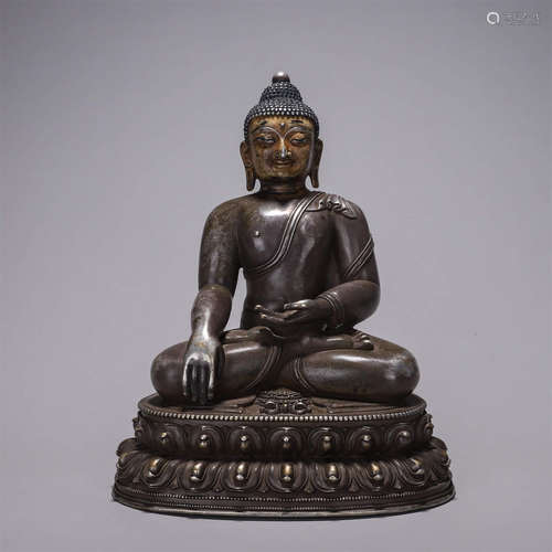 A silver buddha statue