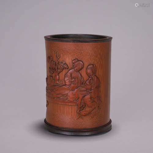 A figure carved bamboo brush pot