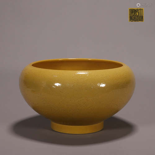 A yellow glazed dragon carved porcelain bowl