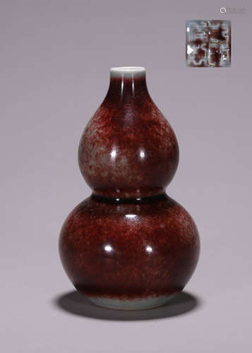 A red glazed porcelain gourd-shaped vase