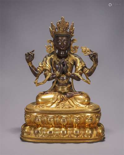 A gilding copper four-armed Guanyin statue