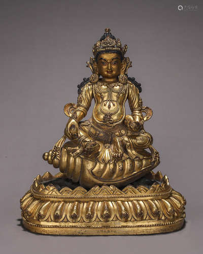 A gilding copper yellow Jambhala statue