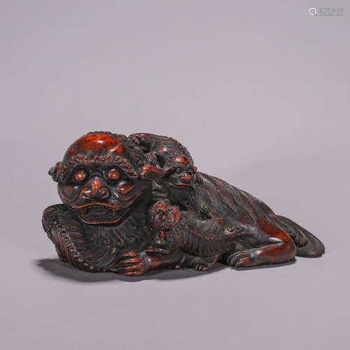 A bamboo root carved lion paperweight