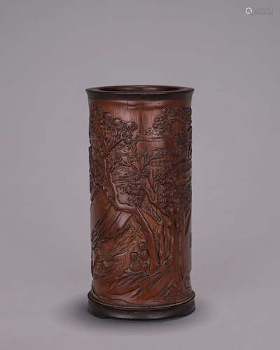 A landscape and figure carved bamboo brush pot