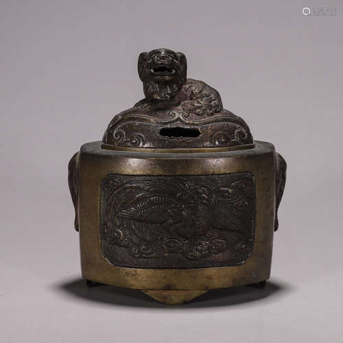 A hollowed out phoenix bird patterned copper lion incense bu...