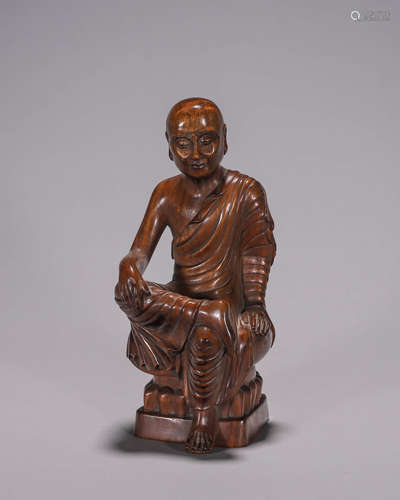 A fragrant rosewood fakir statuette