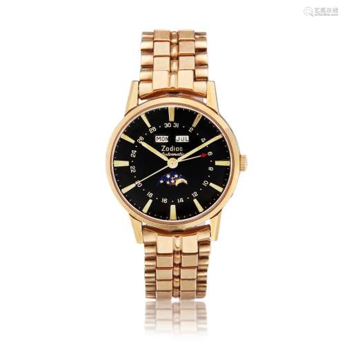 A gold plated and stainless steel triple calendar wristwatch...