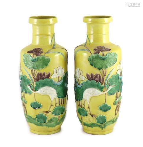 A pair of Chinese yellow ground ‘crane and lotus’ rouleau va...