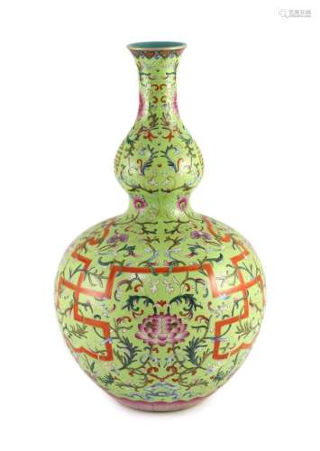 A Chinese lime green sgraffito ground double gourd vase, Qia...