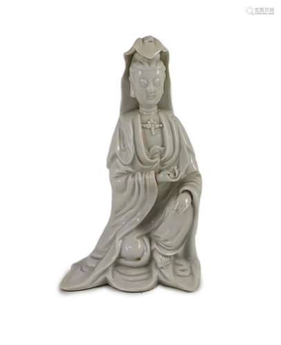 A Chinese blanc-de-chine seated figure of Guanyin, Dehua kil...