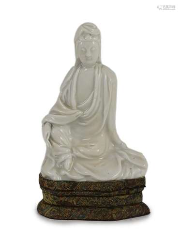 A Chinese blanc-de-chine seated figure of Guanyin, Dehua kil...