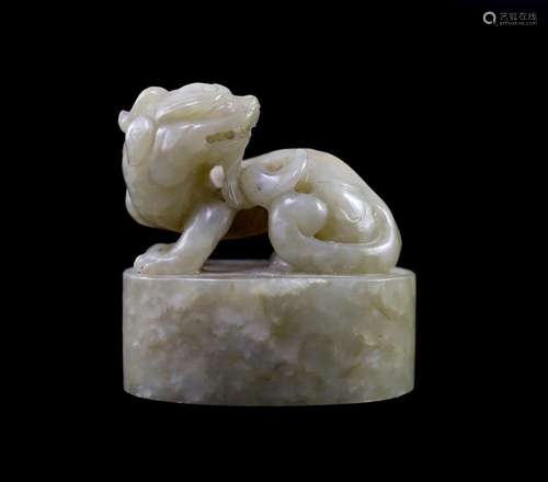 A Chinese celadon and white mottled jade ‘lion-dog’ seal, 18...