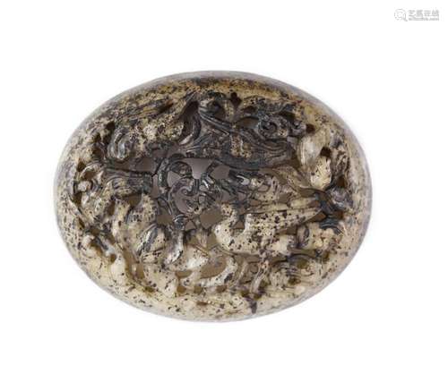 A Chinese pale grey and black jade oval plaque, Yuan dynasty...