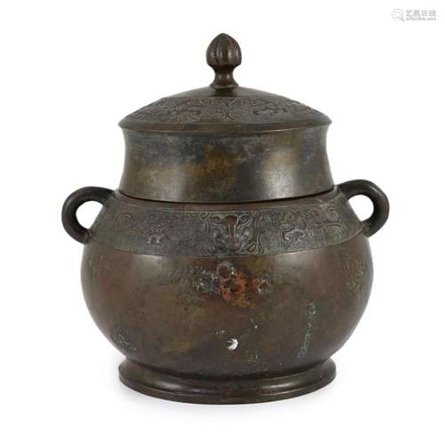 A Chinese Ming bronze jar and cover, hu, 26cm high, old repa...